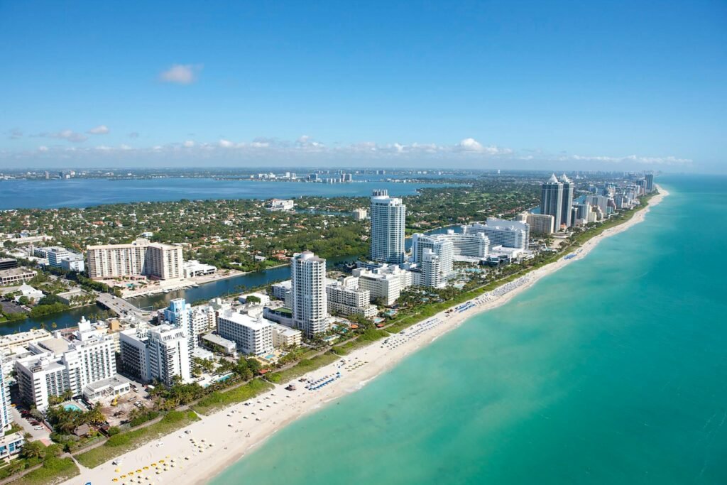 Stunning aerial view of Miami Beach's skyline along the Atlantic Ocean, ideal for travel and adventure imagery.